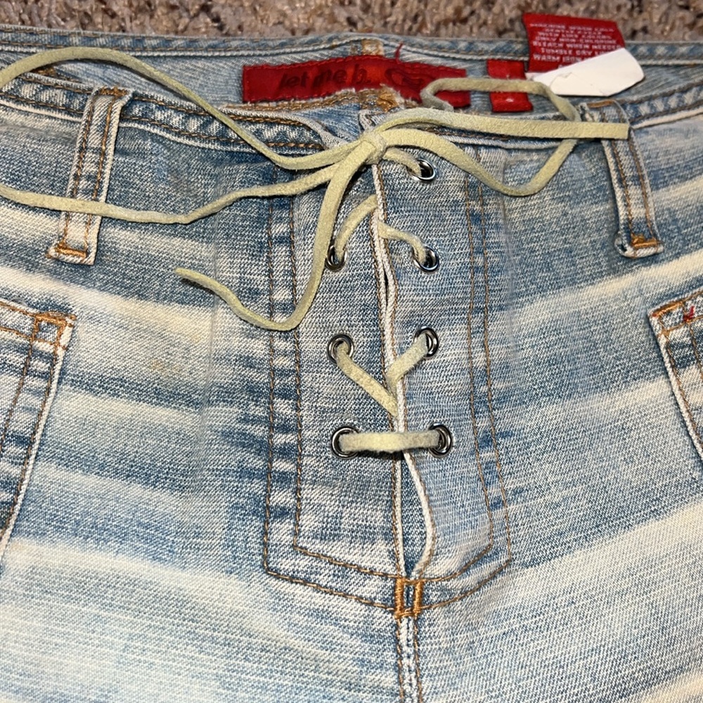 Vintage Y2K low rise lace up crop jeans.